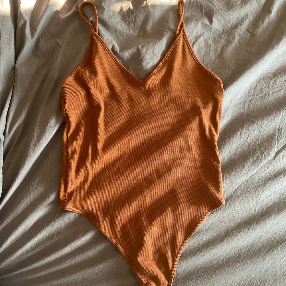 BP burnt orange colored bodysuit size small
